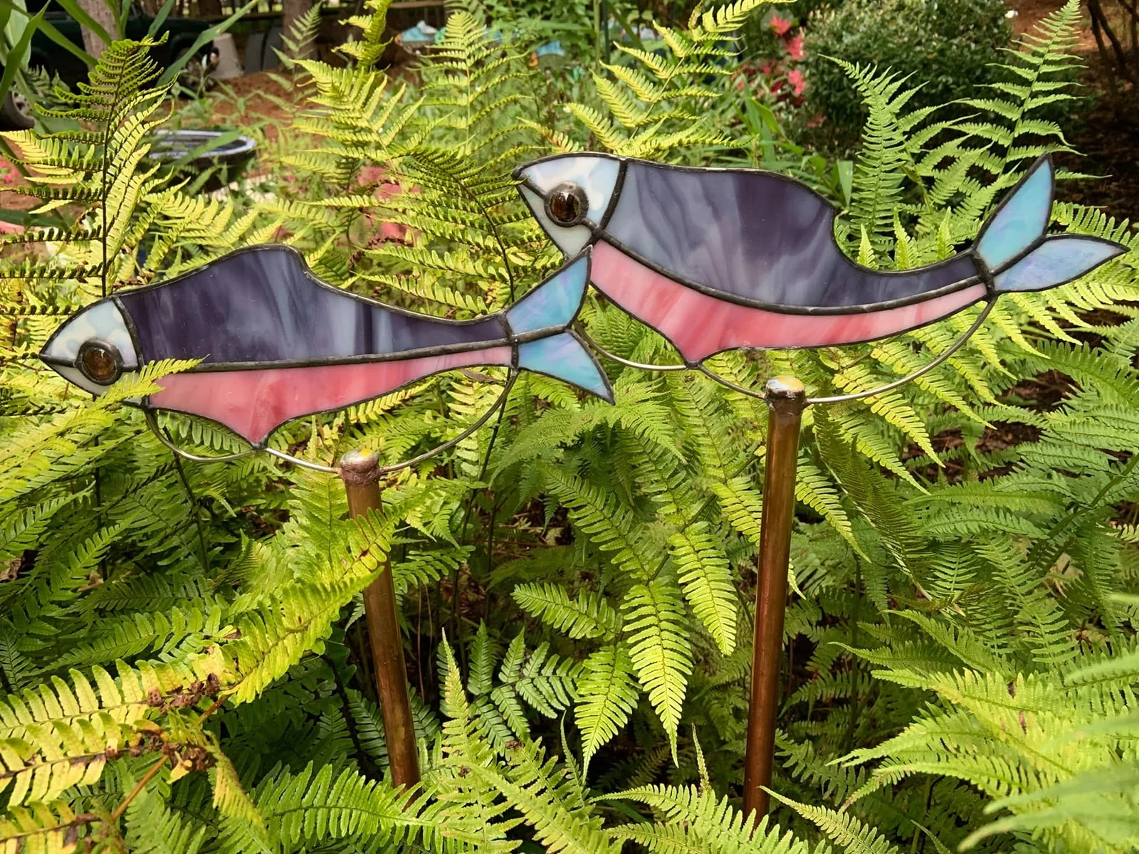 Pink fish garden stakes — original photograph